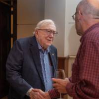 President Emeritus Don Lubbers shaking hands with other event attendee